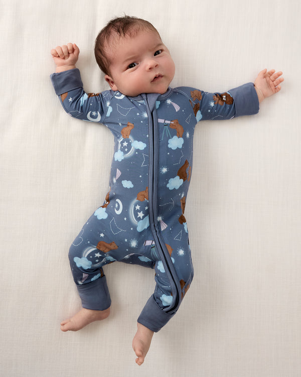 Aerial view of newborn wearing the Constellation Cubs Zippy