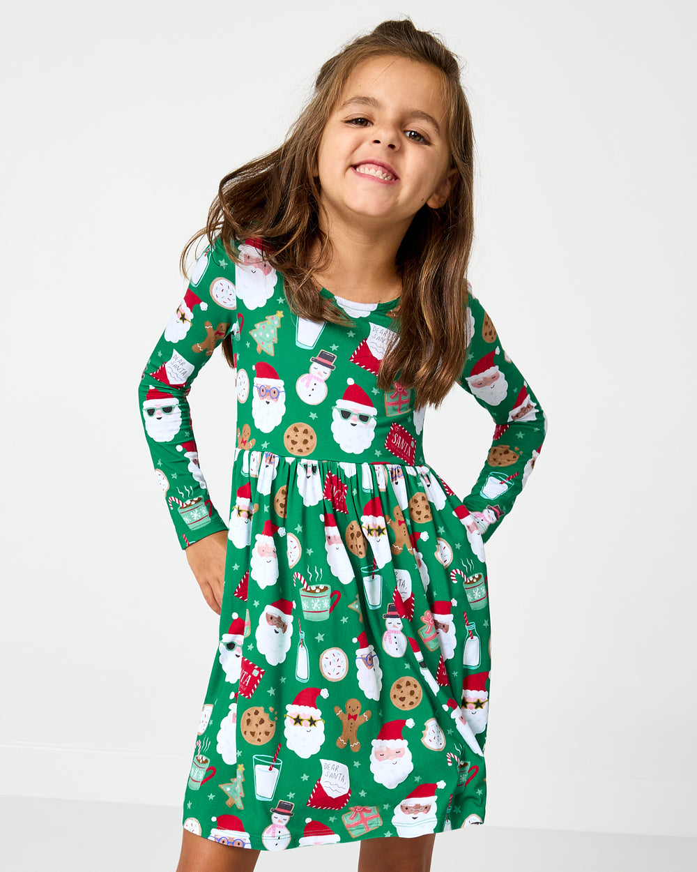 Close up of girl wearing the Cookies for Santa Bow Back Skater Dress