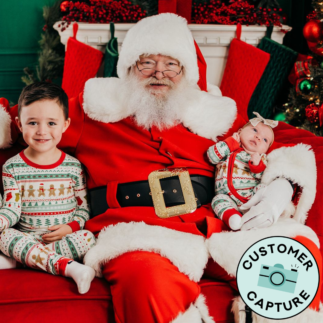 Customer Capture image of Santa with two children. The two children are wearing Fair Isle pajamas in Zippy and Two Piece Styles 