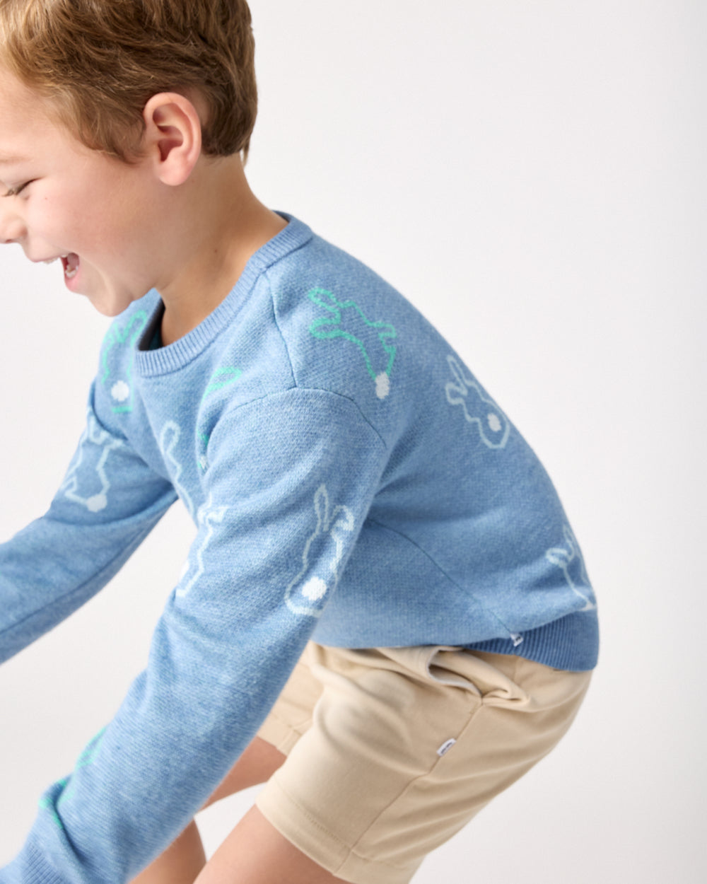 Close up of child wearing the Cozy Cottontails Sweater