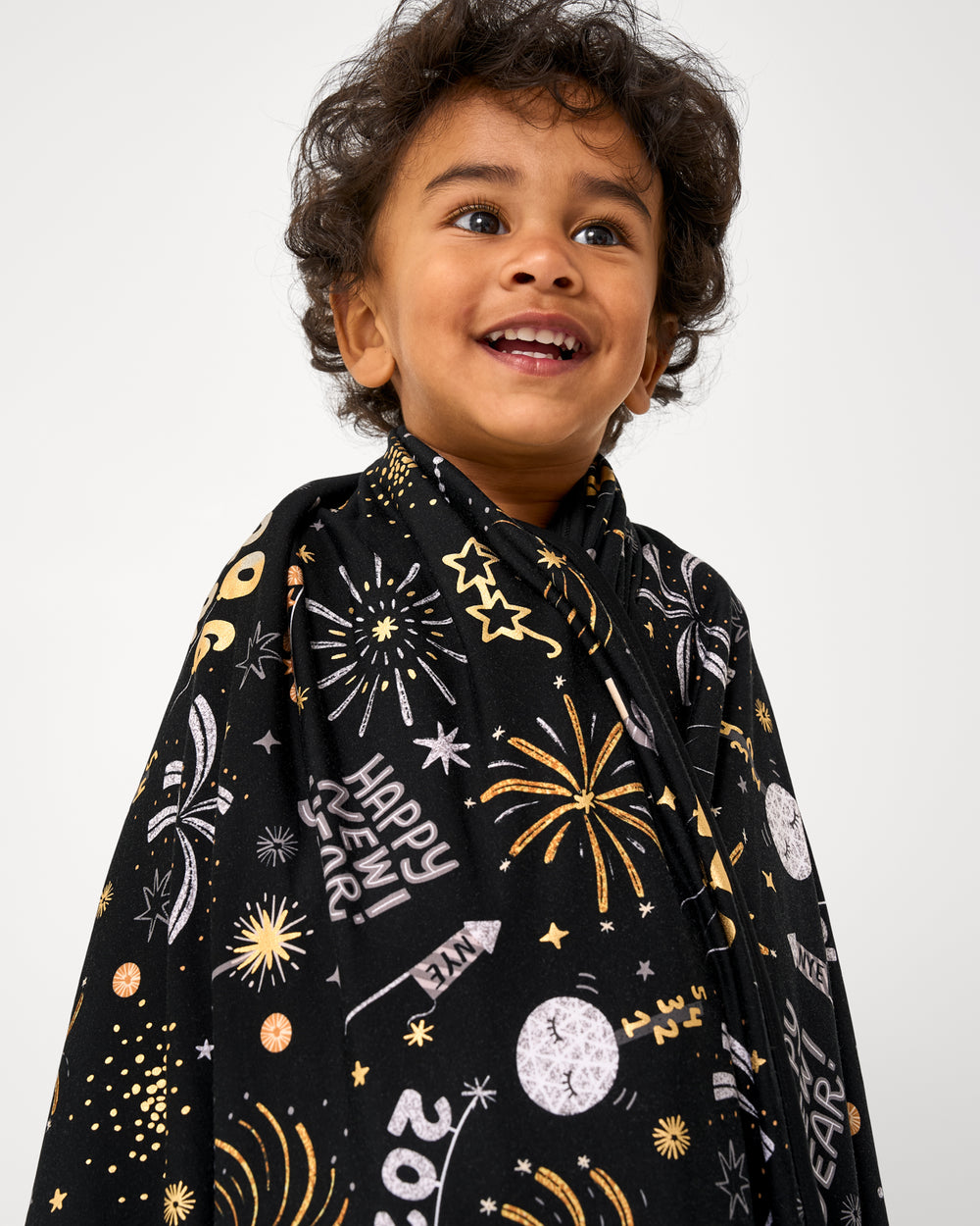 Close up of child wrapped in the Cozy Countdown Large Cloud Blanket®
