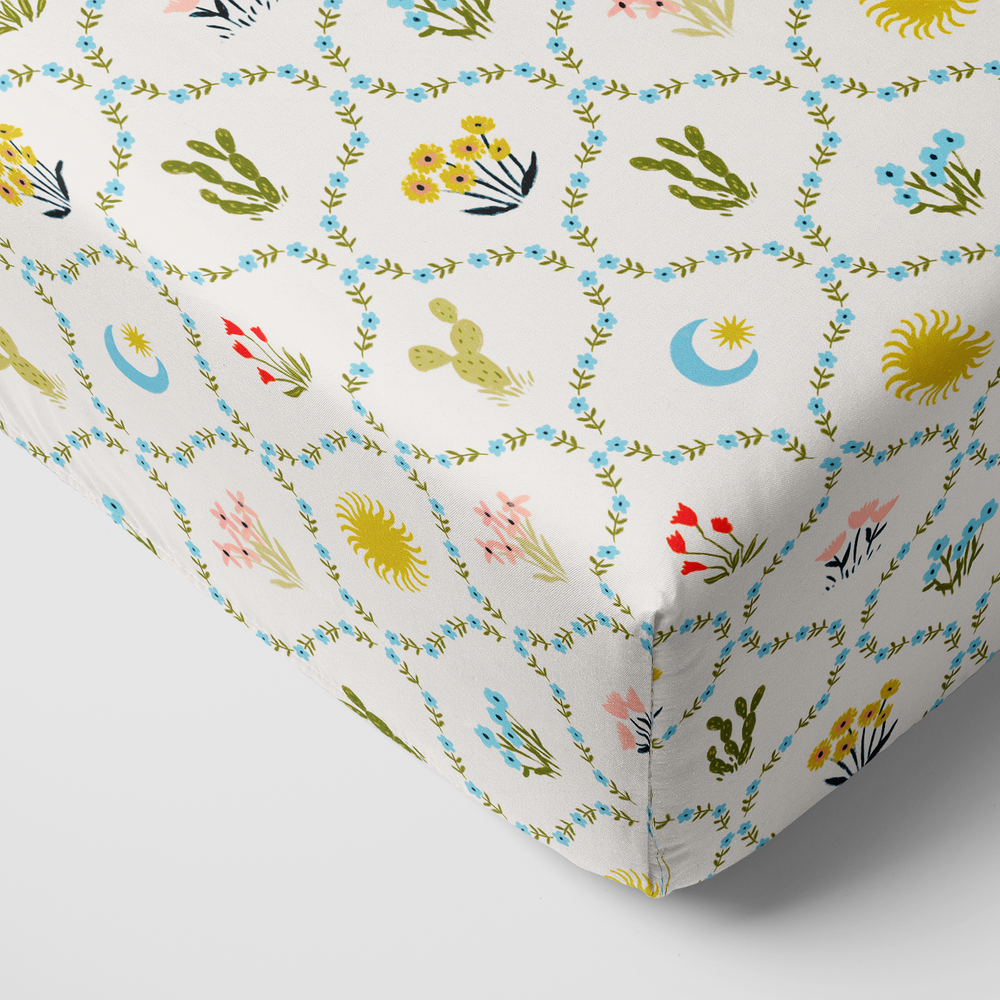 Corner view of the Desert Meadow Fitted Crib Sheet
