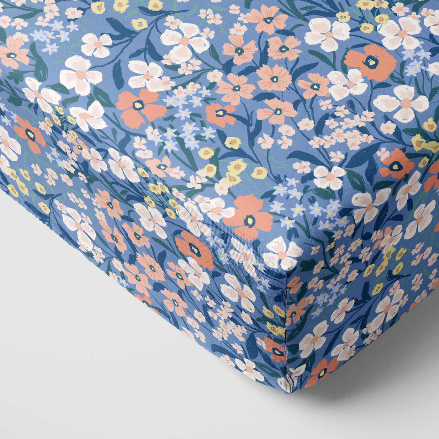 Corner view of the Petite Petals Fitted Crib Sheet