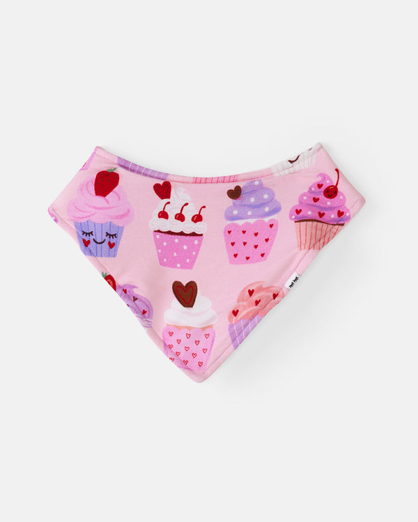 Flat lay of the Cupcake Kisses Bandana Bib
