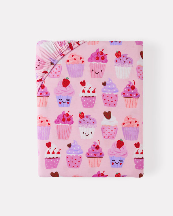 Flat lay of the Cupcake Kisses Fitted Crib Sheet