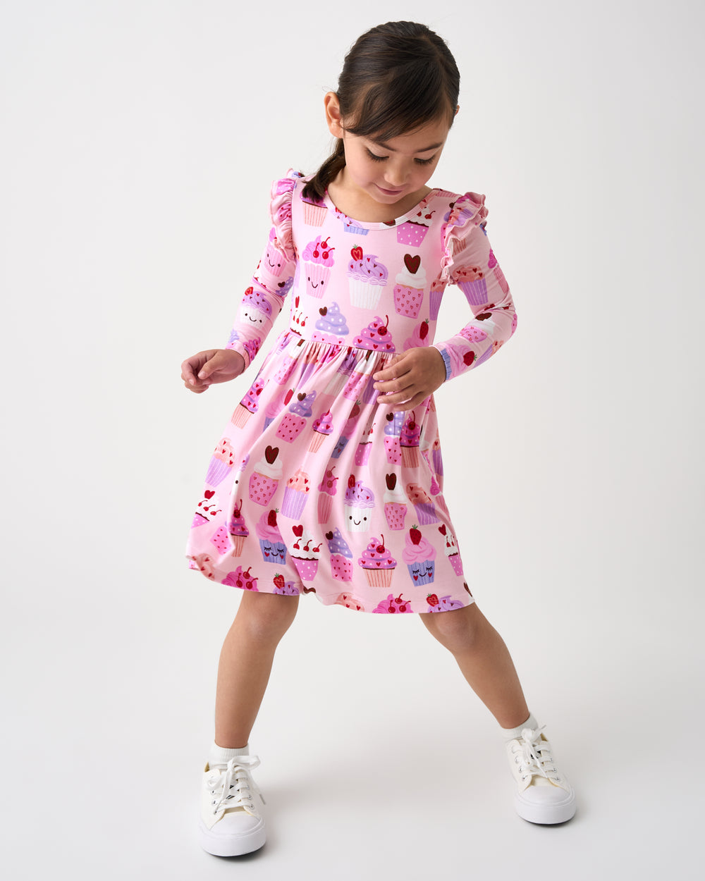 Alternate standing girl wearing the Cupcake Kisses Flutter Skater Dress