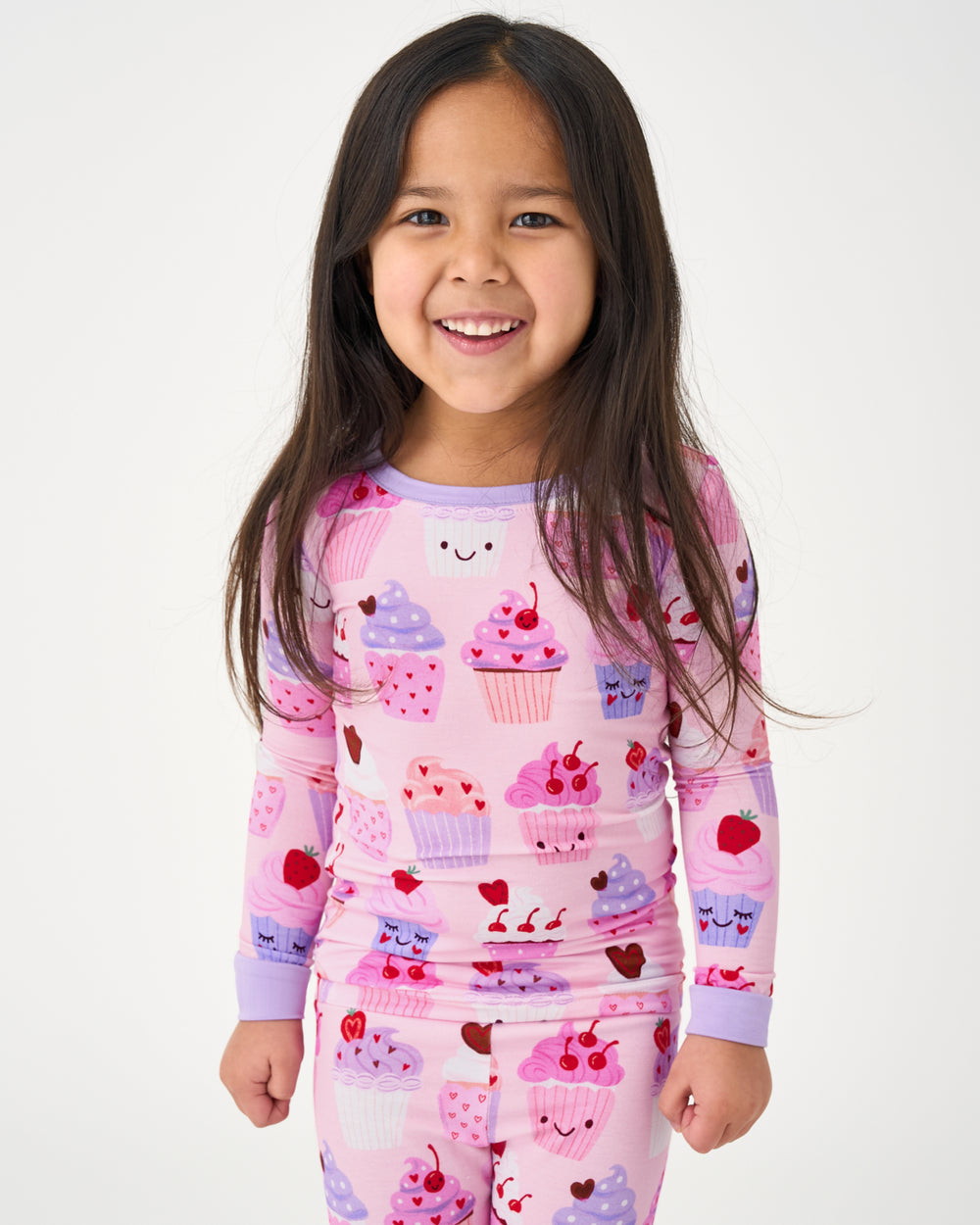 Standing girl wearing the Cupcake Kisses Two-Piece Pajama Set