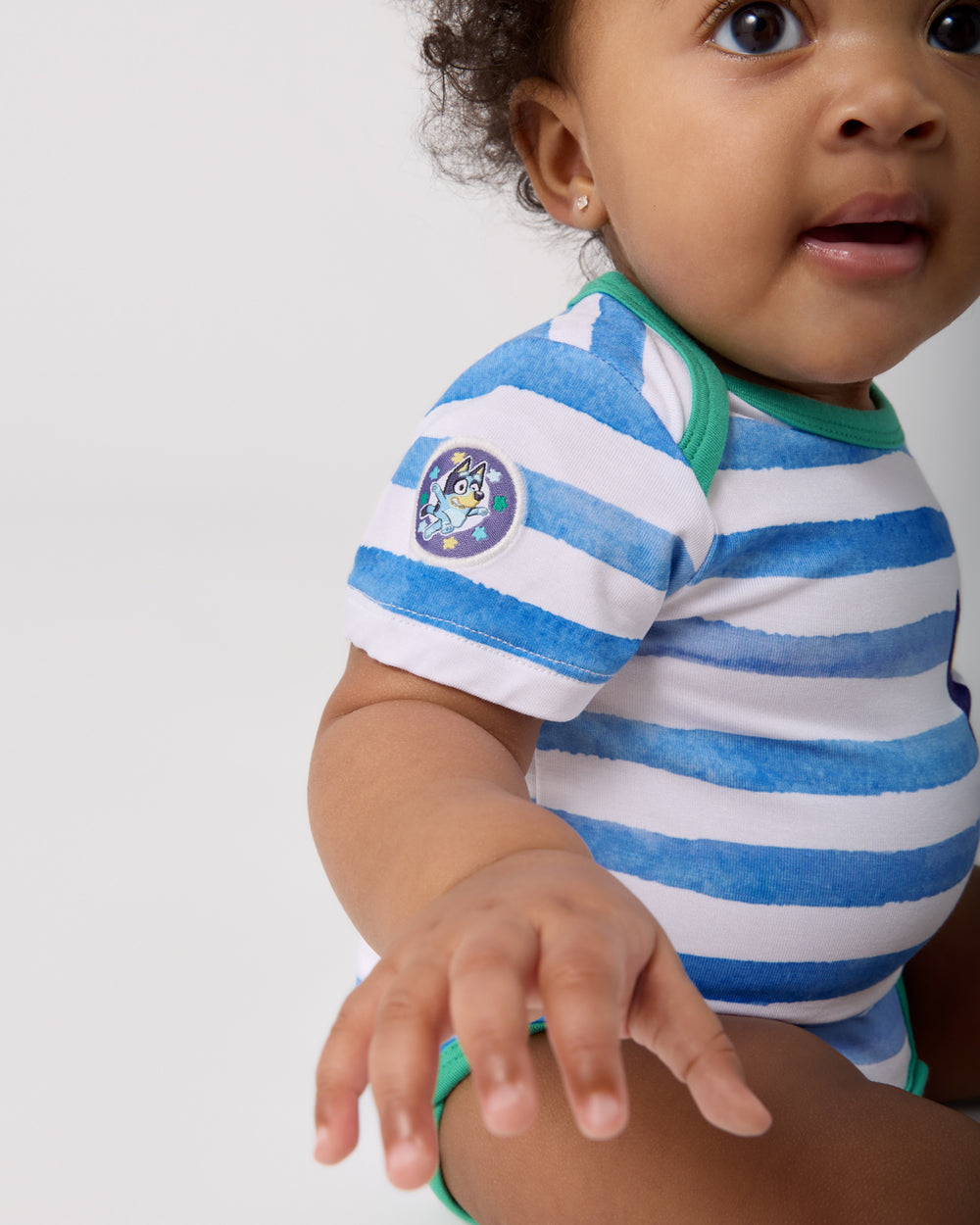 Close up of the Bluey patch on the Bluey Bodysuit
