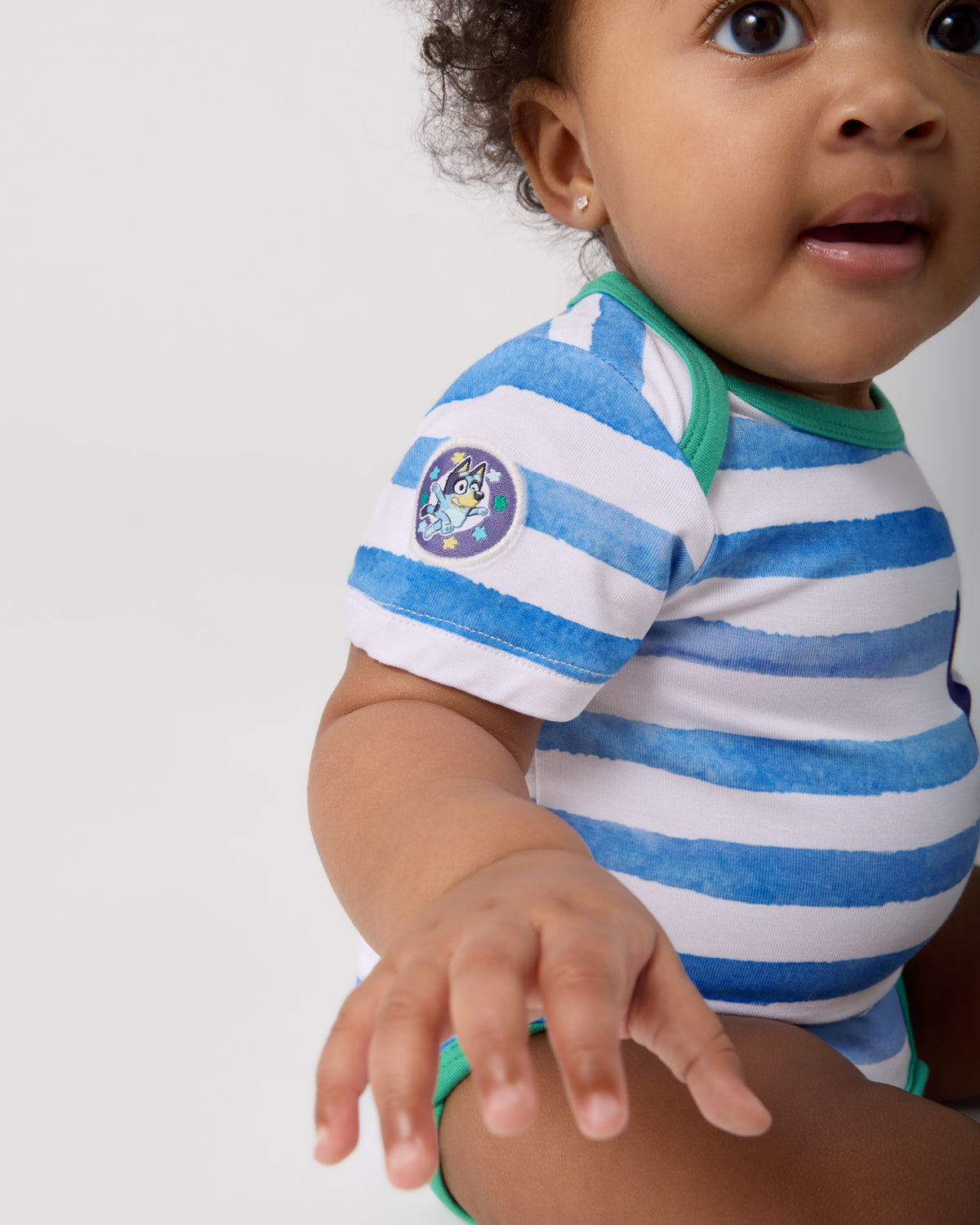 Close up of the Bluey patch on the Bluey Bodysuit