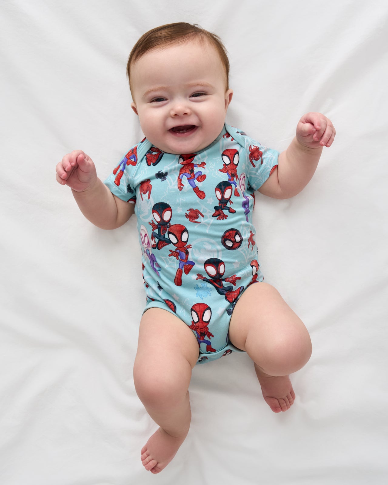 Aerial view of baby wearing the Spidey & Friends Tiny Webs Short Sleeve Bodysuit