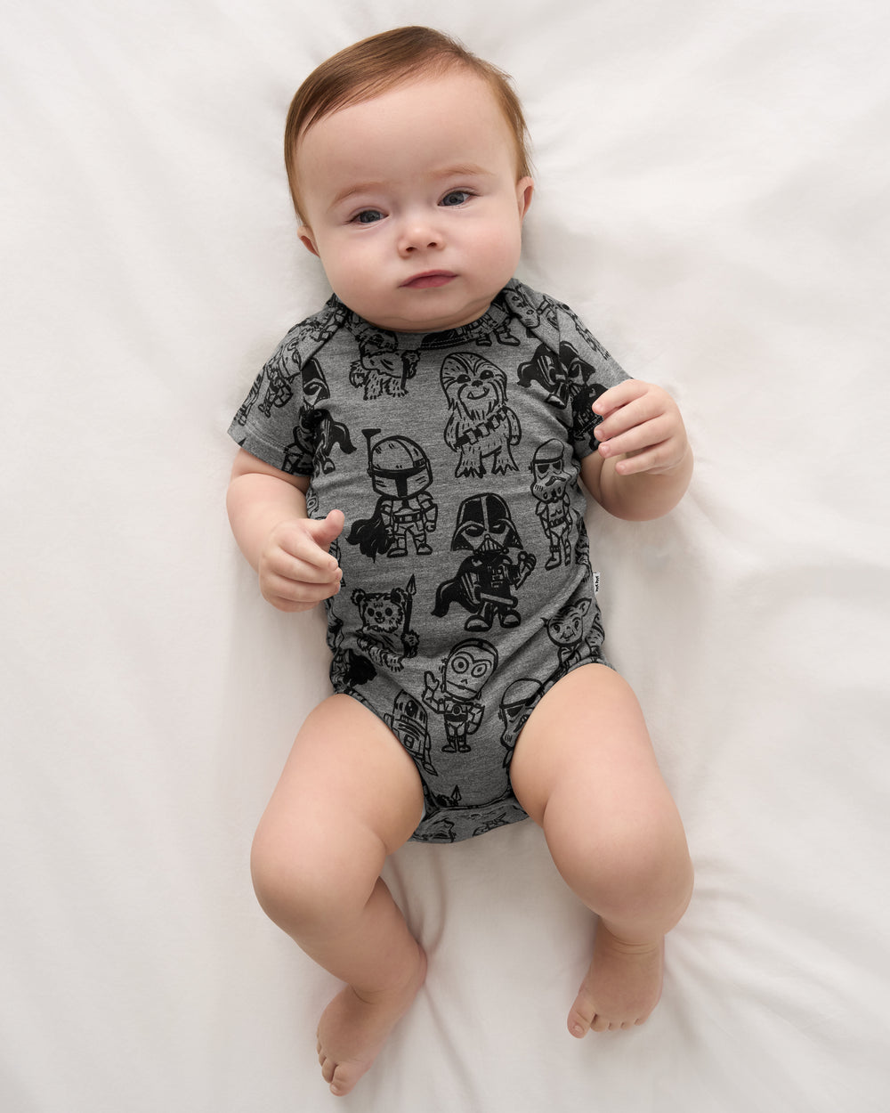 Alternate aerial view of baby wearing the Star Wars Far, Far, Away Friends Short Sleeve Bodysuit