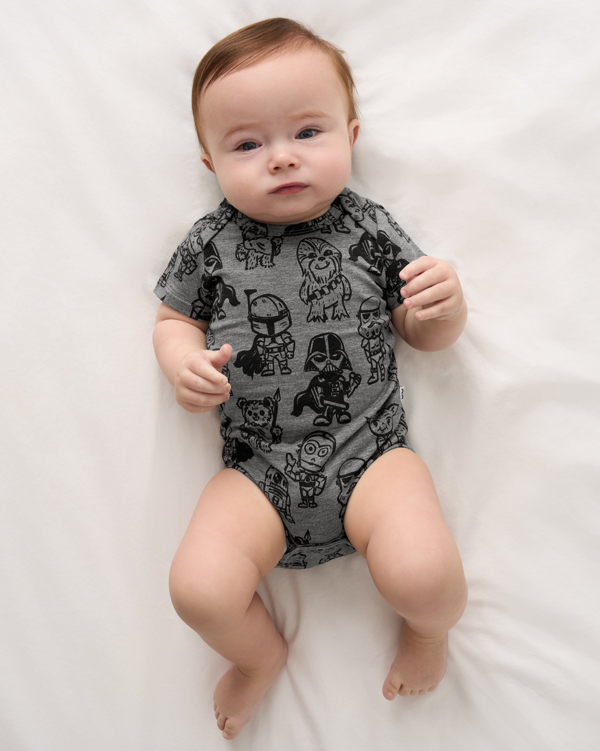 Alternate aerial view of baby wearing the Star Wars Far, Far, Away Friends Short Sleeve Bodysuit