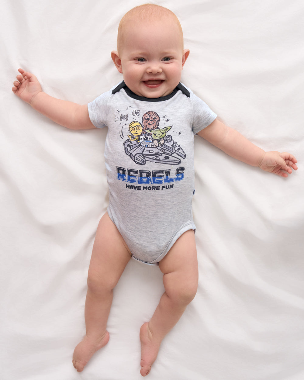 Aerial view of baby wearing the Star Wars Little Rebels Short Sleeve Bodysuit
