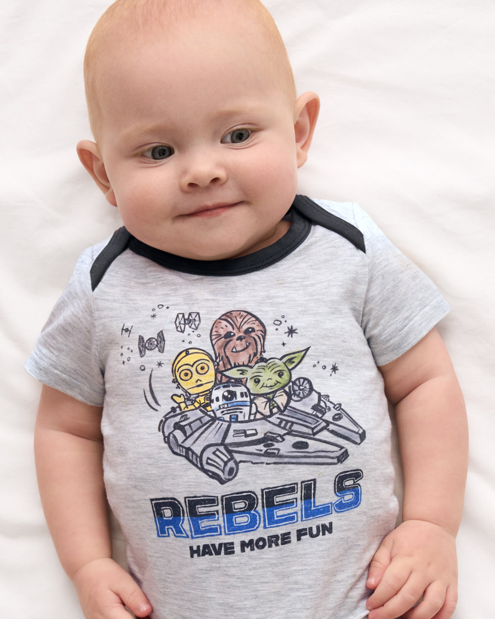 Close up of newborn wearing the Star Wars Little Rebels Short Sleeve Bodysuit