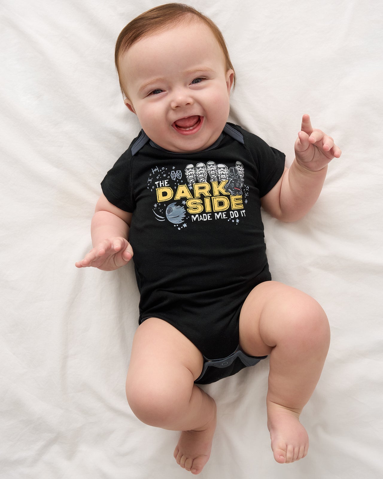 Aerial view of baby wearing the Star Wars Dark Side Short Sleeve Bodysuit