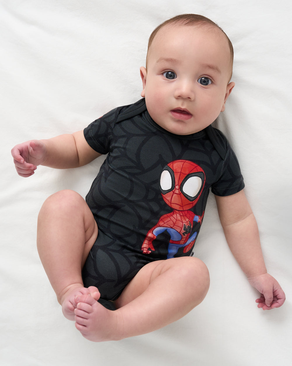 Aerial view of baby wearing the Spidey & Friends Spidey Short Sleeve Bodysuit