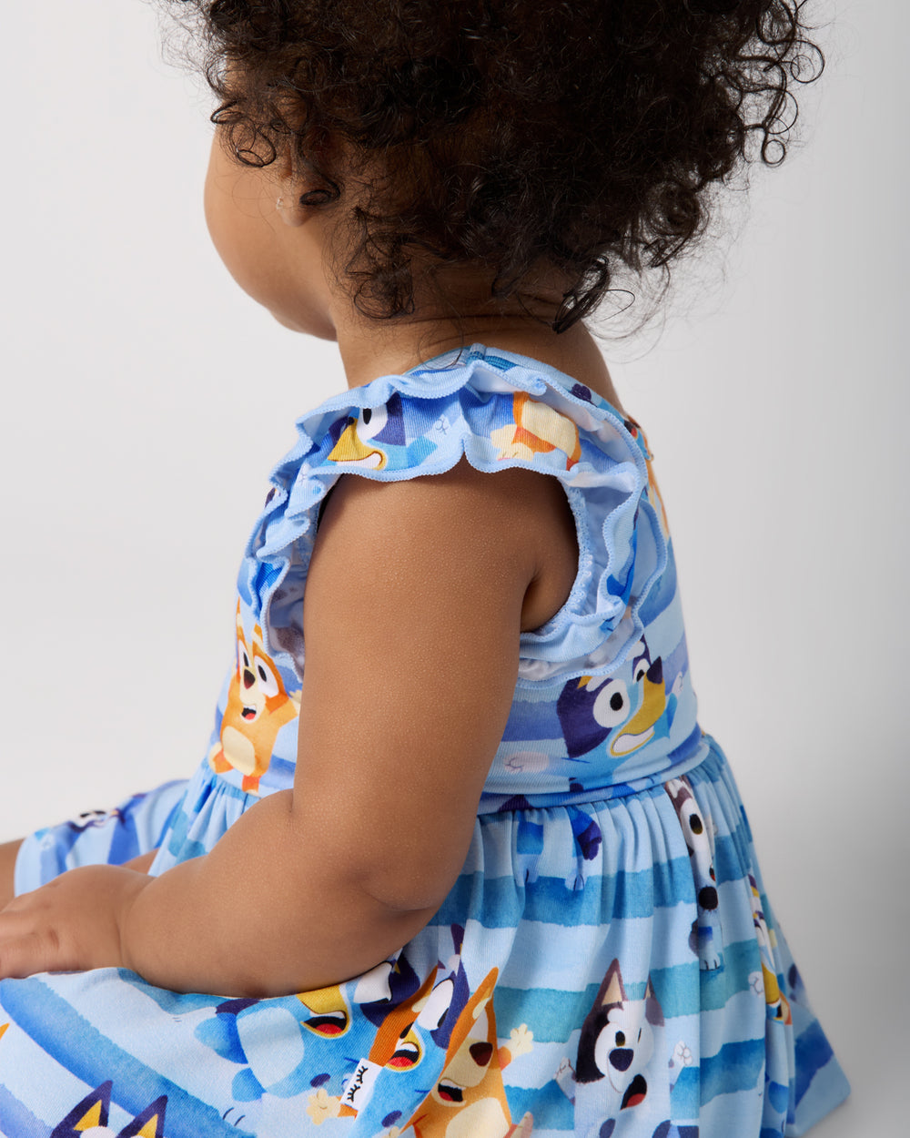 Close up of the ruffle sleeve on the Bluey Dance All Day Flutter Skater Dress with Bodysuit