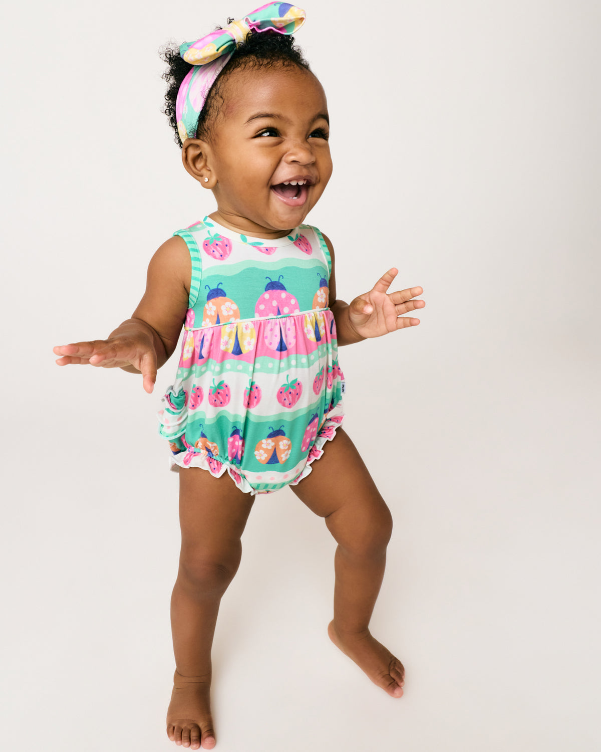 Alternate baby wearing the Ladybug Lane Bubble Romper and Luxe Bow Headband