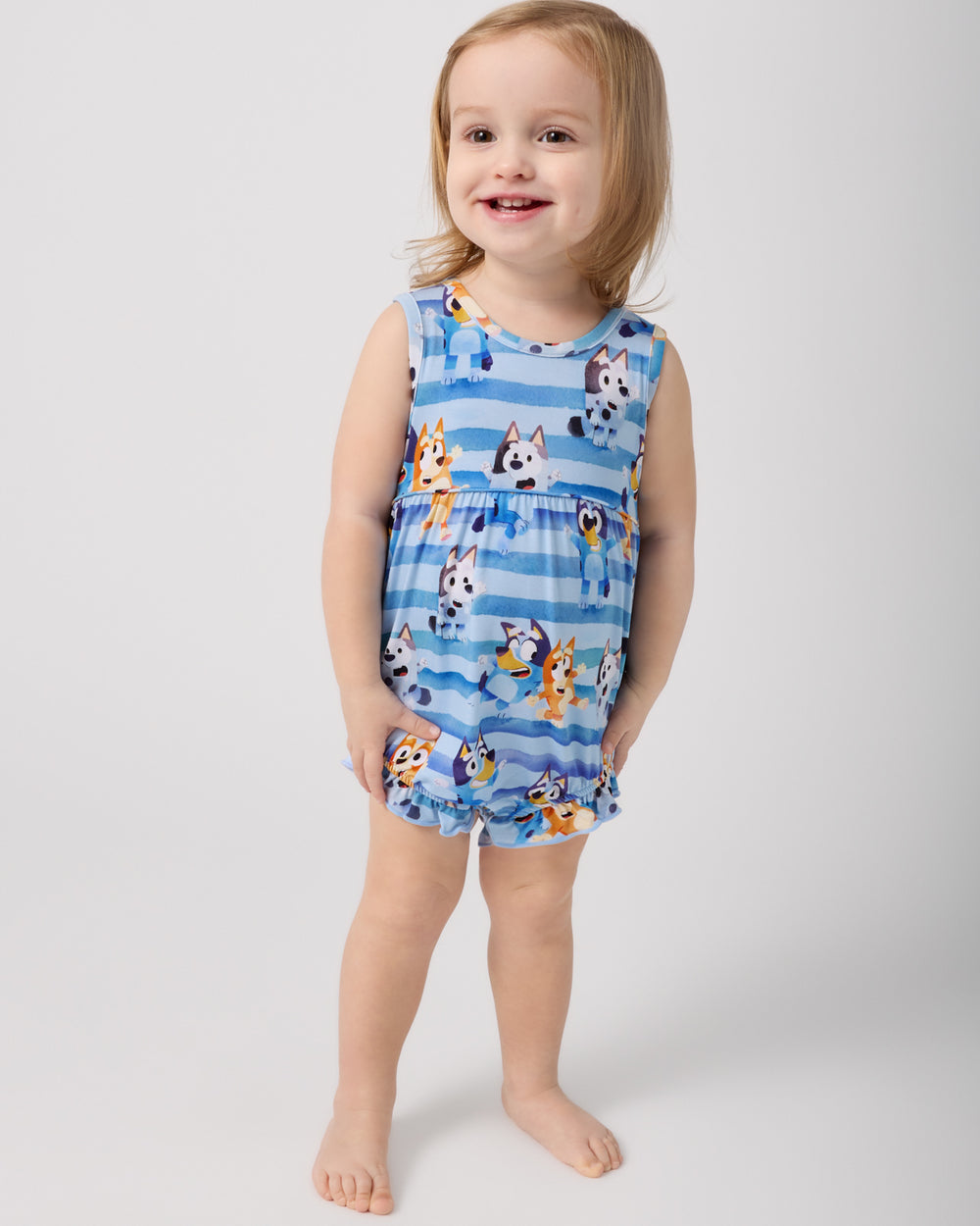 Girl wearing the Bluey Dance All Day Bubble Romper