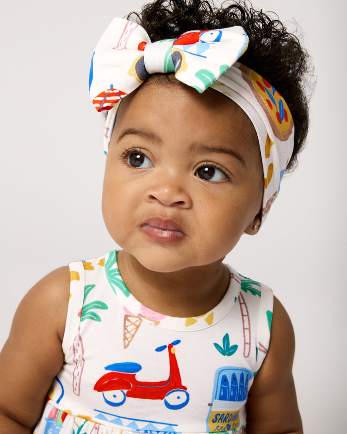 Baby wearing the Ciao Bella Luxe Bow Headband
