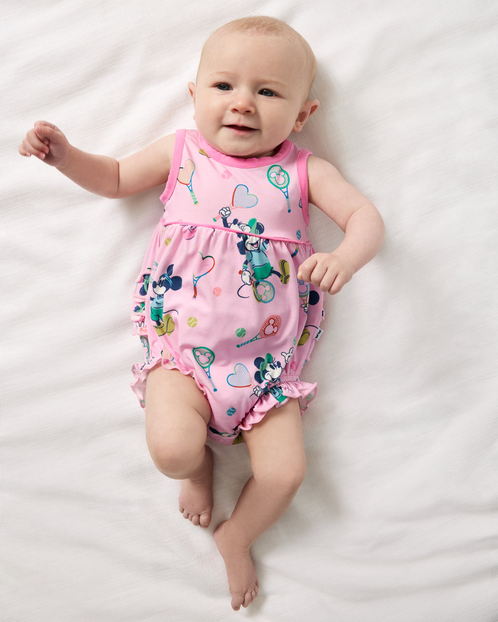 Aerial view of baby wearing the Disney Mickey Mouse & Minnie Mouse Match Bubble Romper