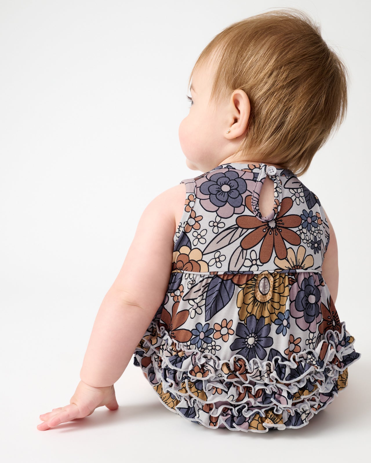 Back view of baby wearing the Wildwood Floral Bubble Romper