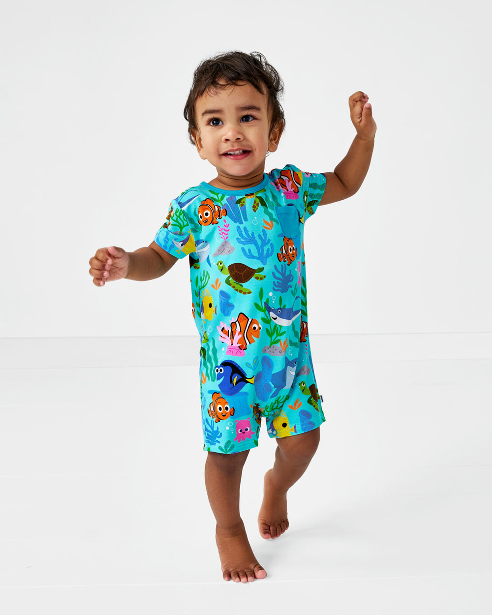 Alternate of walking child wearing the Disney Nemo's Reef Pocket Shorty Romper