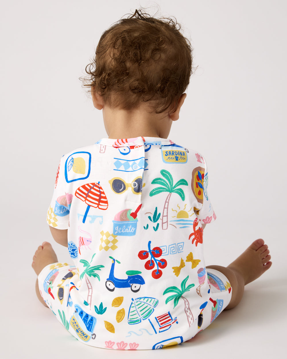 Back view of baby wearing the Ciao Bella Pocket Shorty Romper