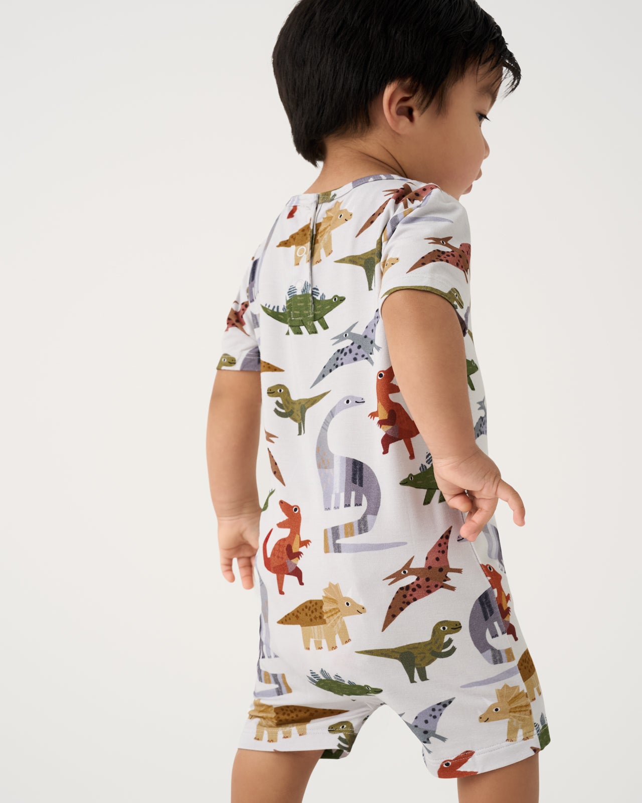 Back view of toddler wearing the Roar & Explore Pocket Shorty Romper