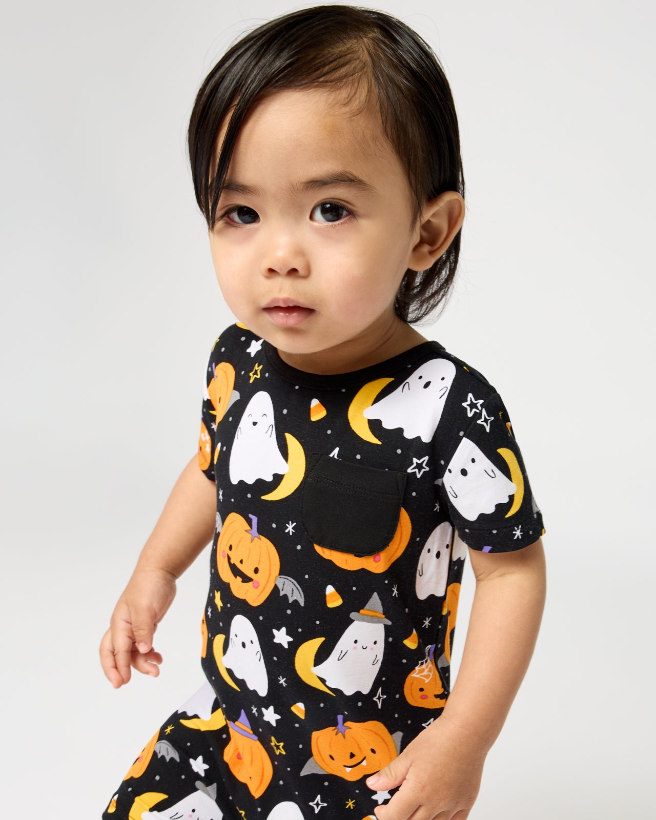 Close up of baby wearing the Moonlit Magic Pocket Shorty Romper