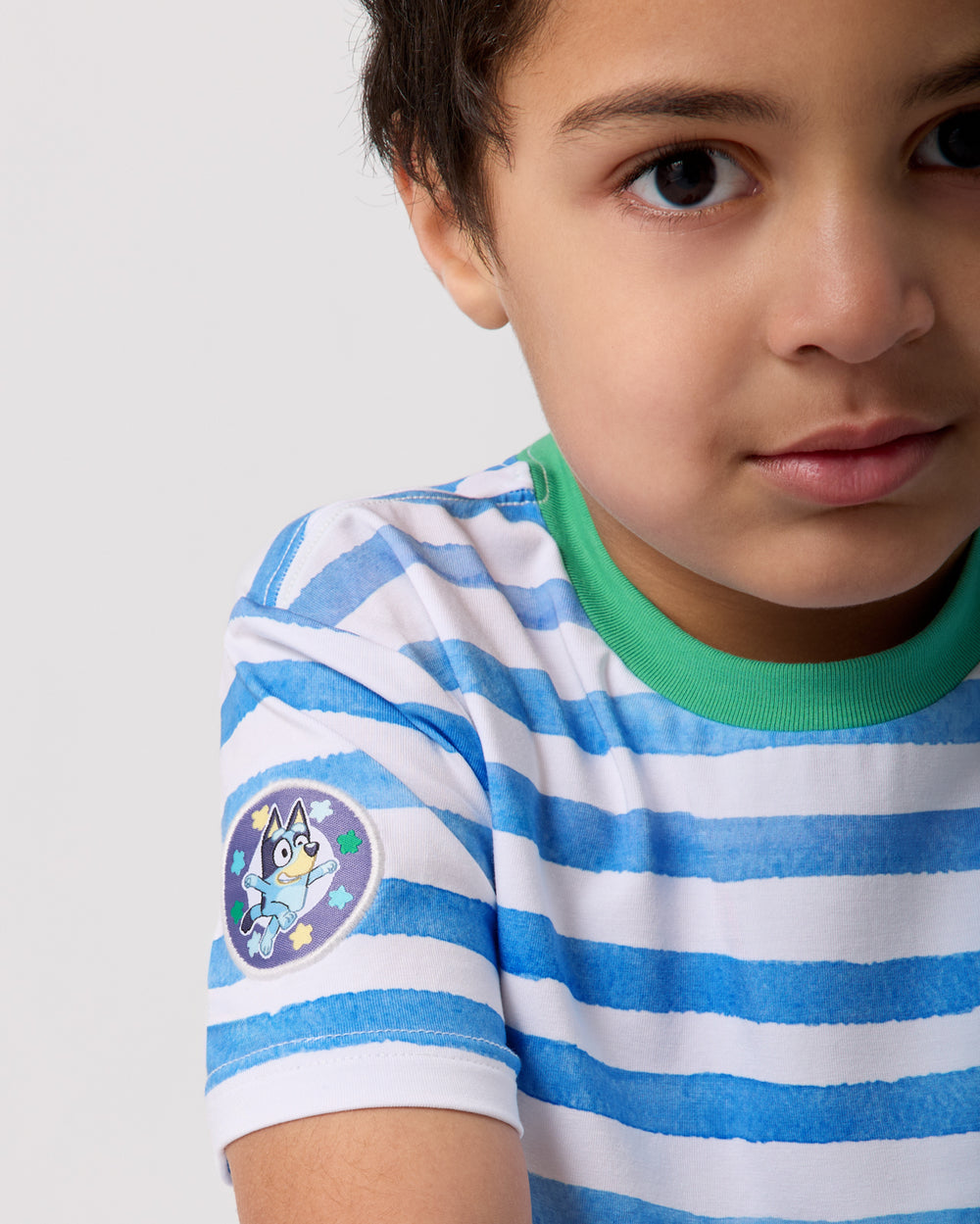 Close up of the sleeve patch detail on the Bluey Relaxed Tee