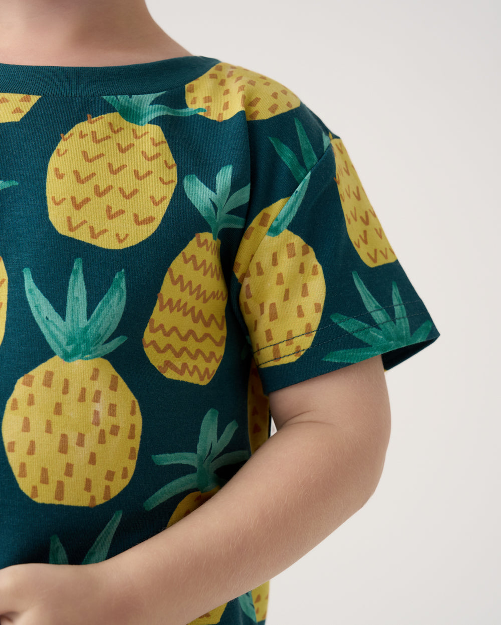 Close up of the short sleeve on the Pineapple Grove Relaxed Tee
