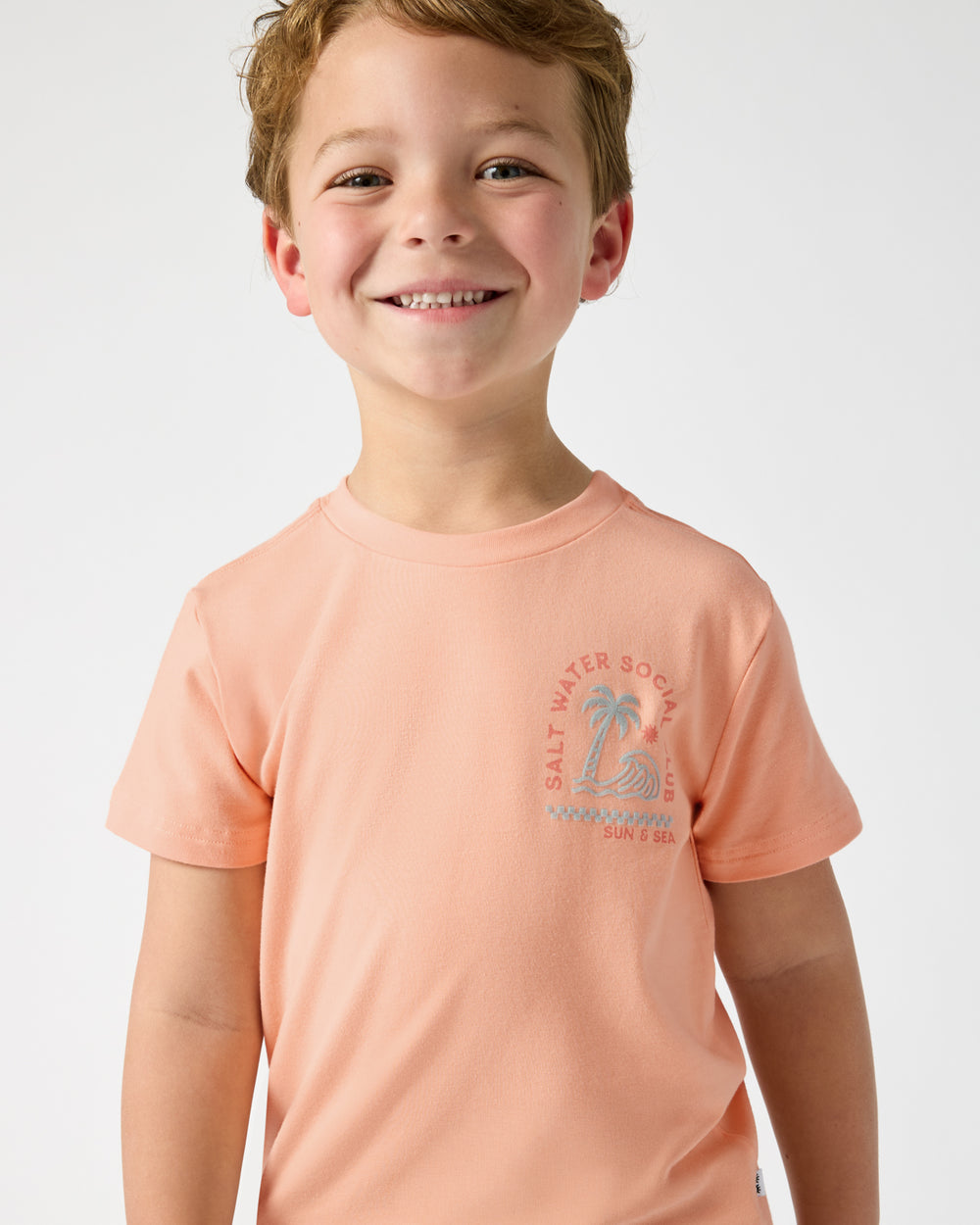 Close up of boy wearing the Salt Water Social Club Relaxed Tee