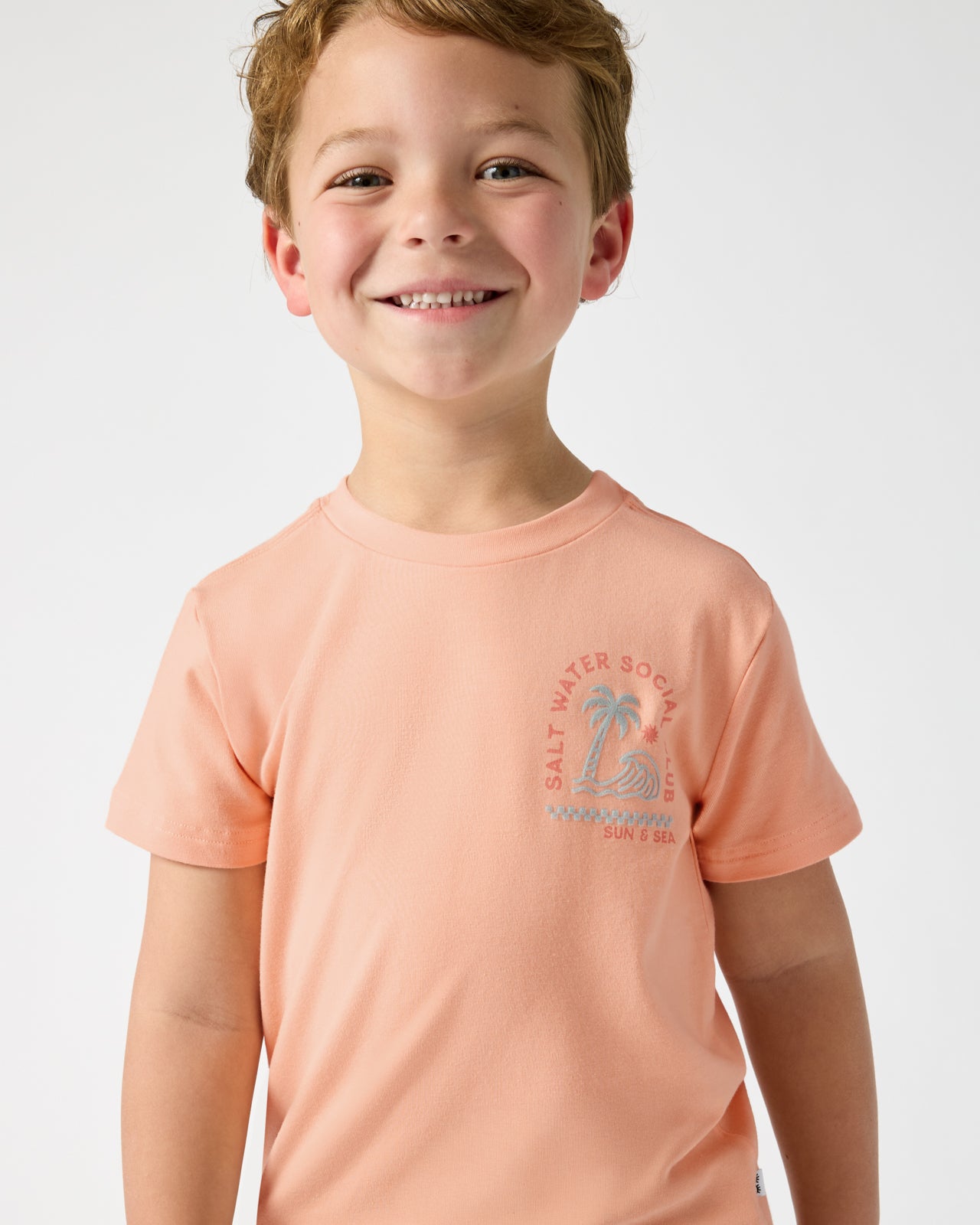 Close up of boy wearing the Salt Water Social Club Relaxed Tee