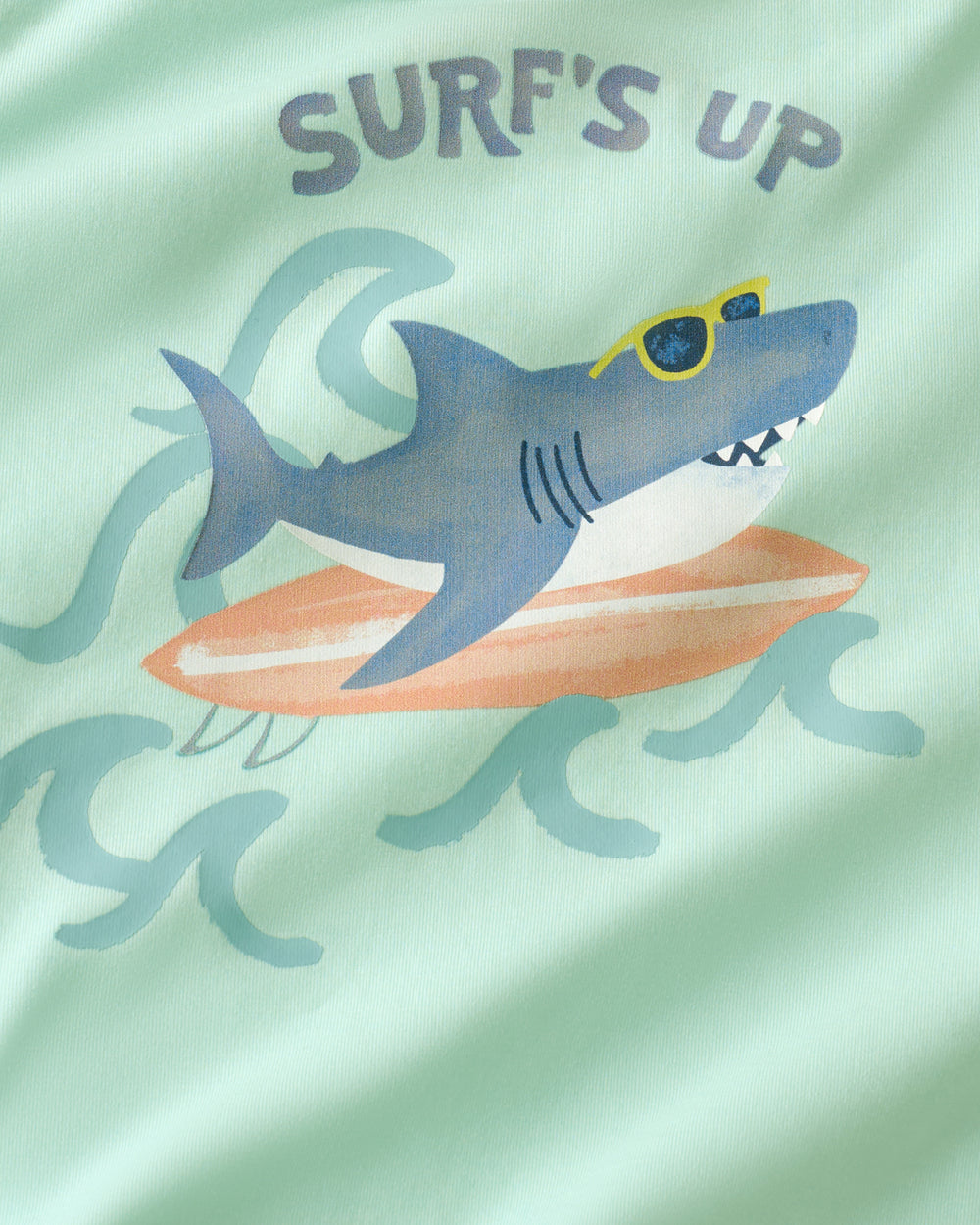 Close up of the graphic detail on the Surf's Up Relaxed Tee