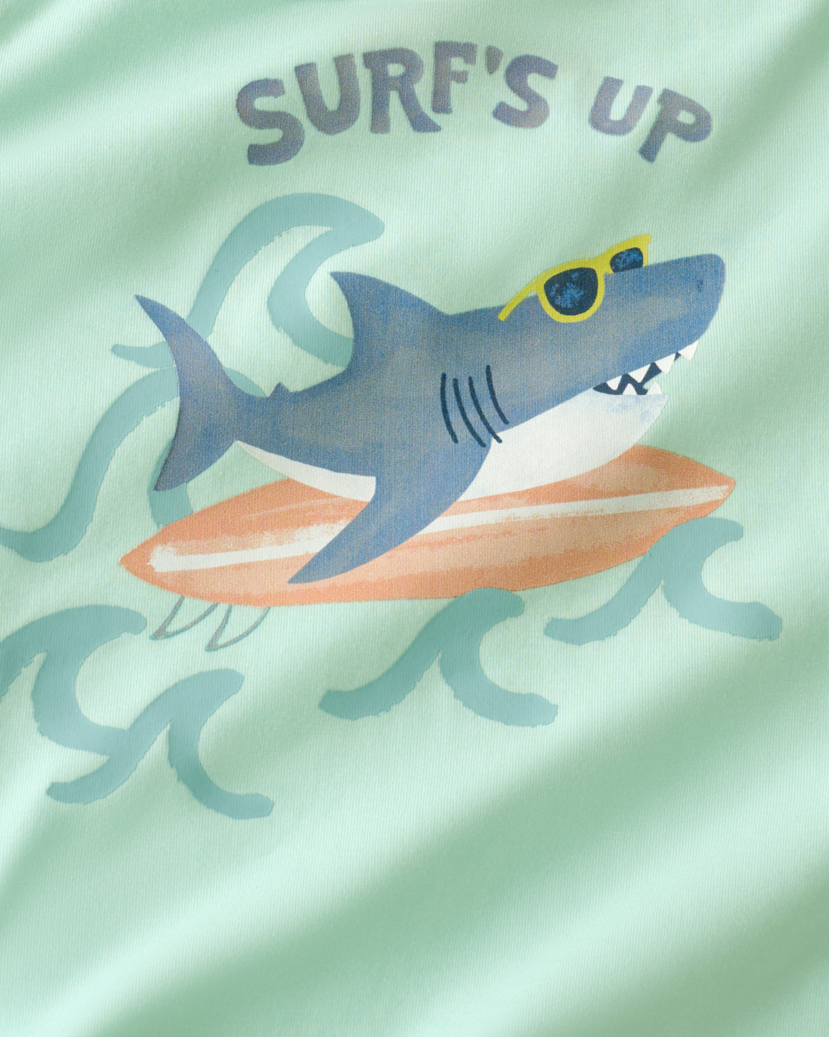 Close up of the graphic detail on the Surf's Up Relaxed Tee