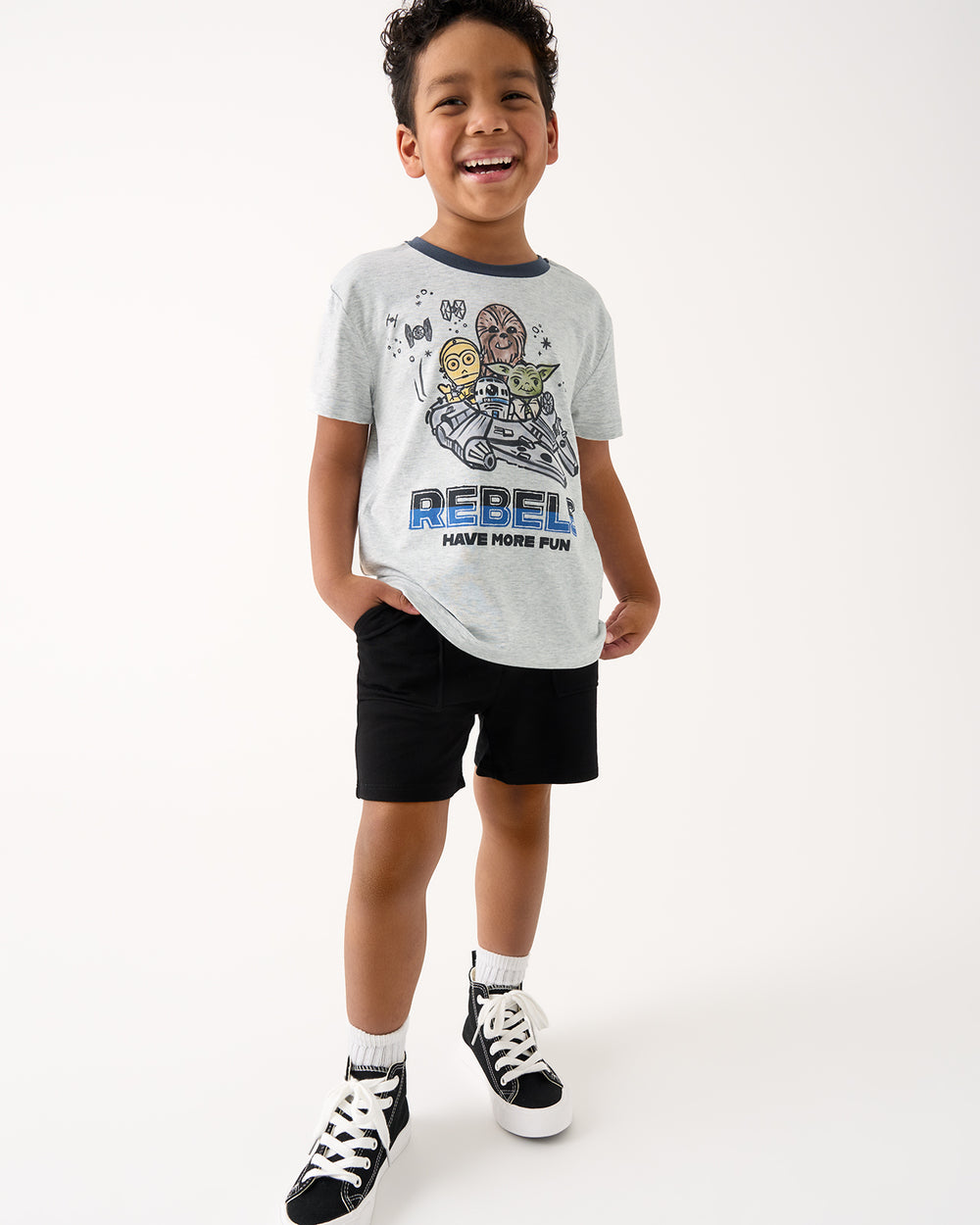 Boy wearing the Star Wars Little Rebels Relaxed Tee with Black Shorts
