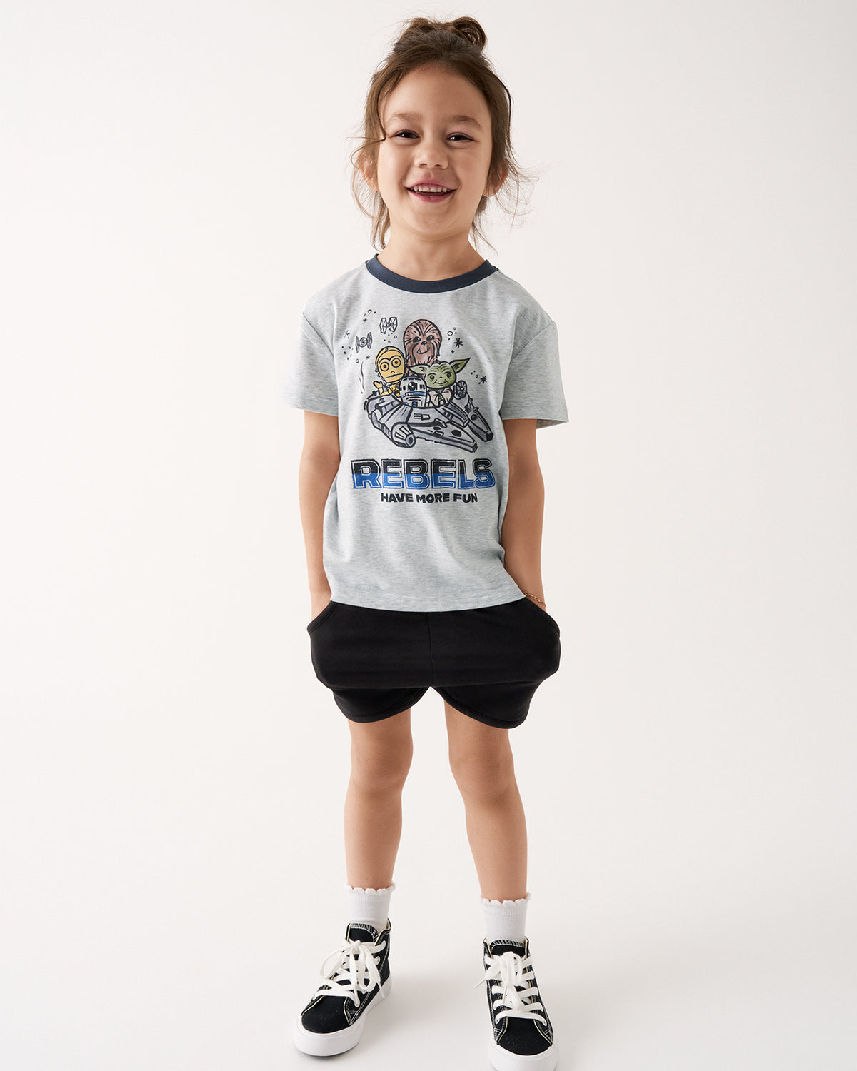 Girl wearing the Star Wars Little Rebels Relaxed Tee with black girls shorts 