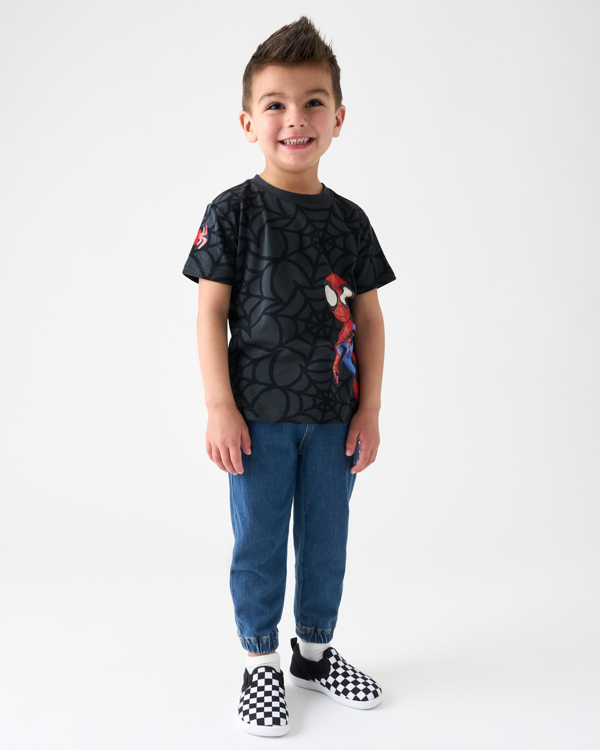 Boy wearing the Spidey & Friends Relaxed Tee with blue denim joggers