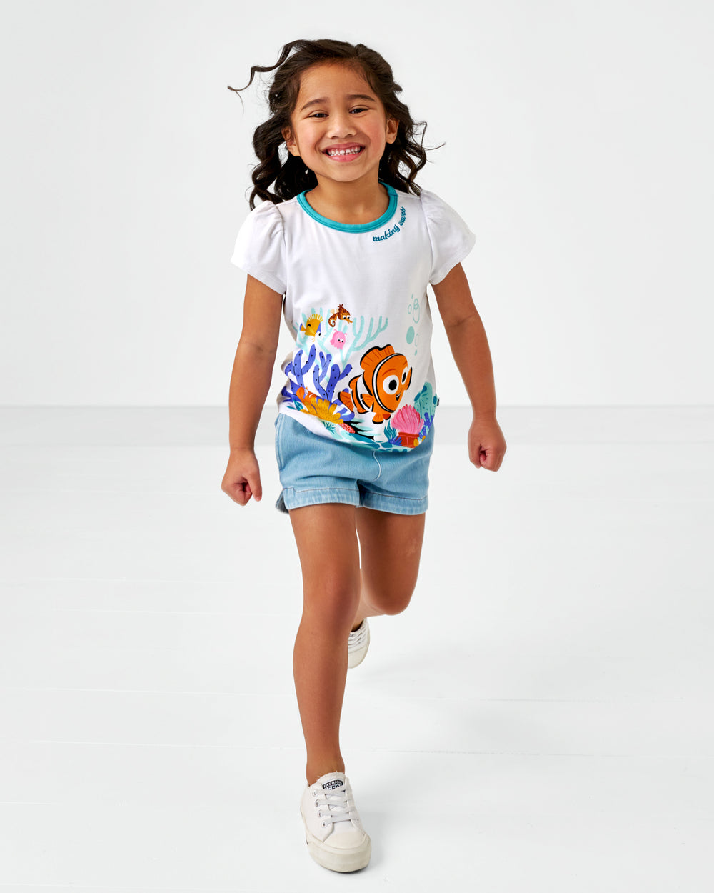 Walking child wearing the Disney Nemo Puff Sleeve bamboo tee