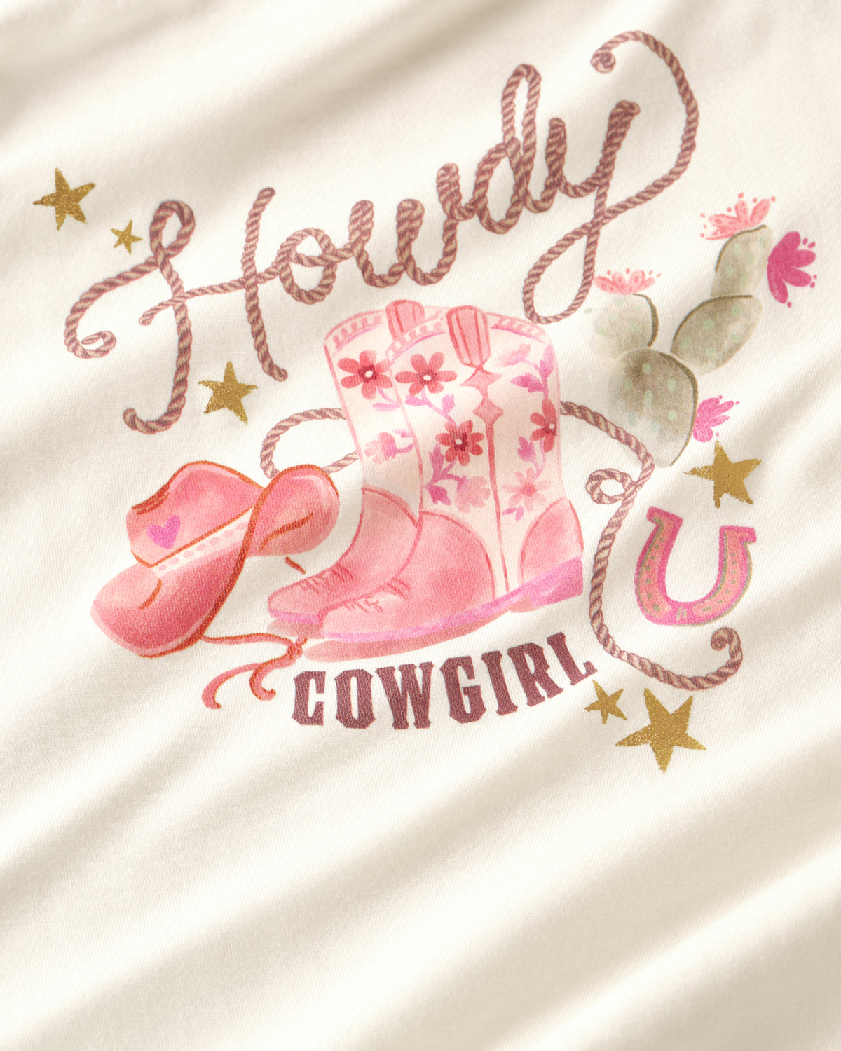 Close up of the graphic detail on the Howdy Cowgirl Puff Sleeve Tee