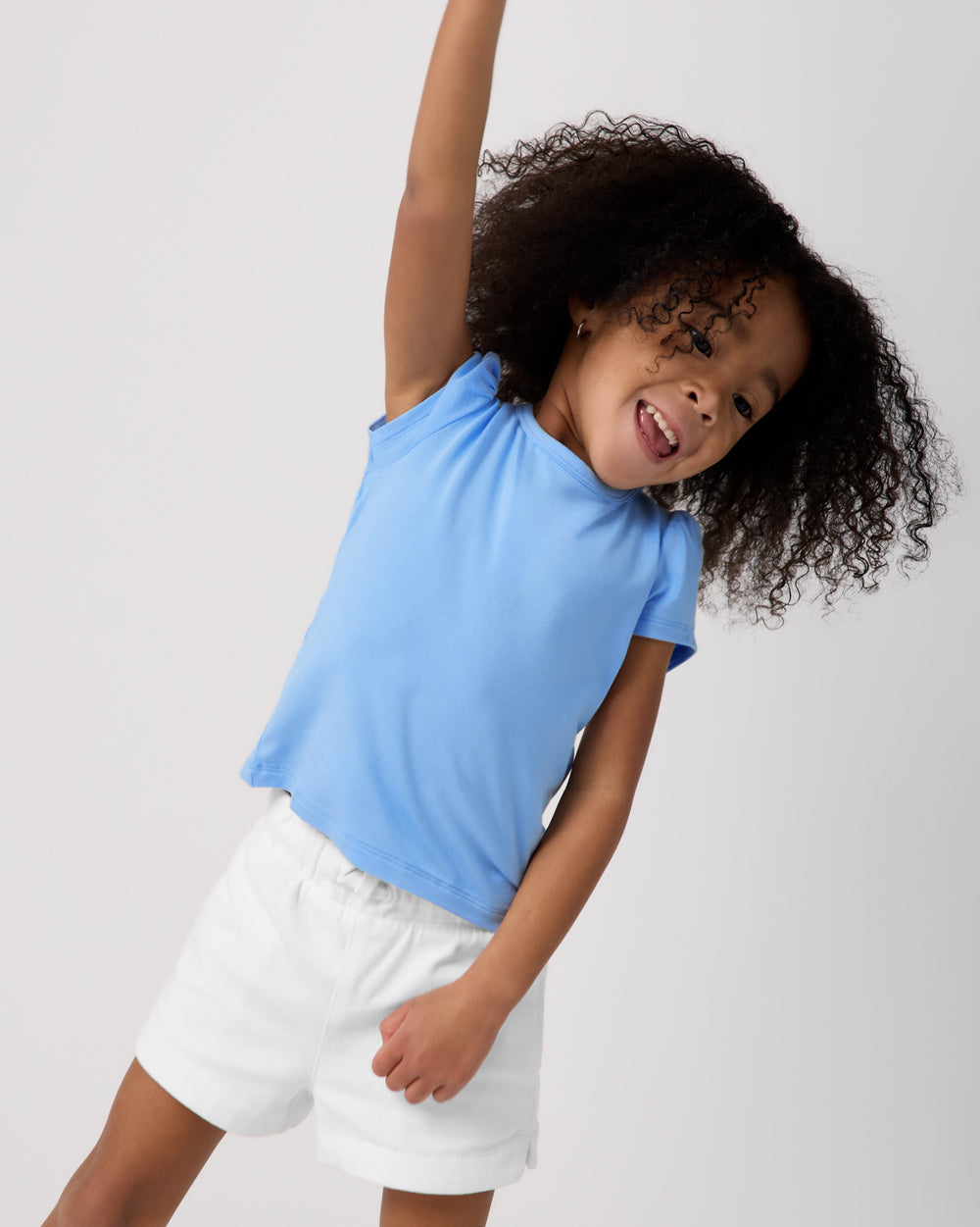 Posing girl wearing the Blue Breeze Puff Sleeve Tee