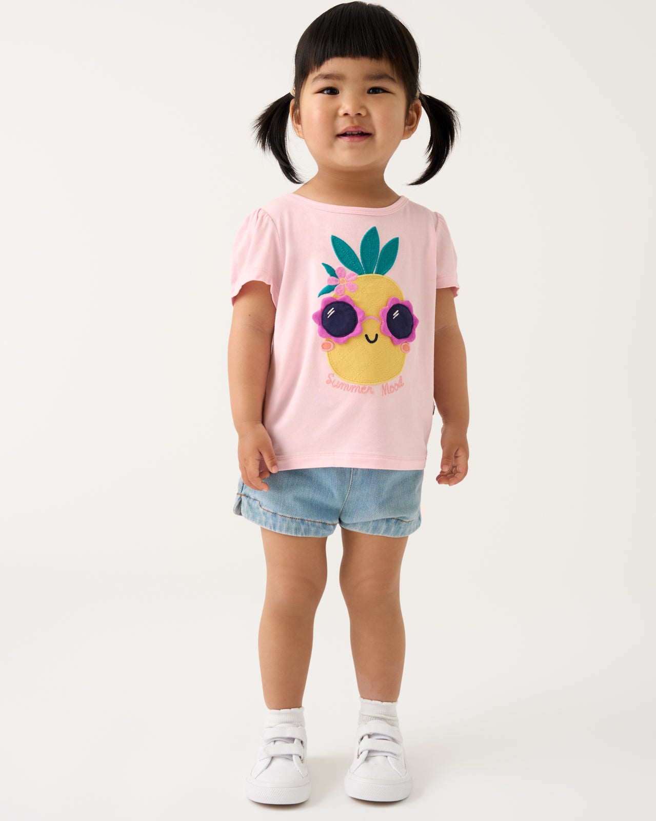 Girl wearing the Summer Mood Puff Sleeve Tee with denim shorts