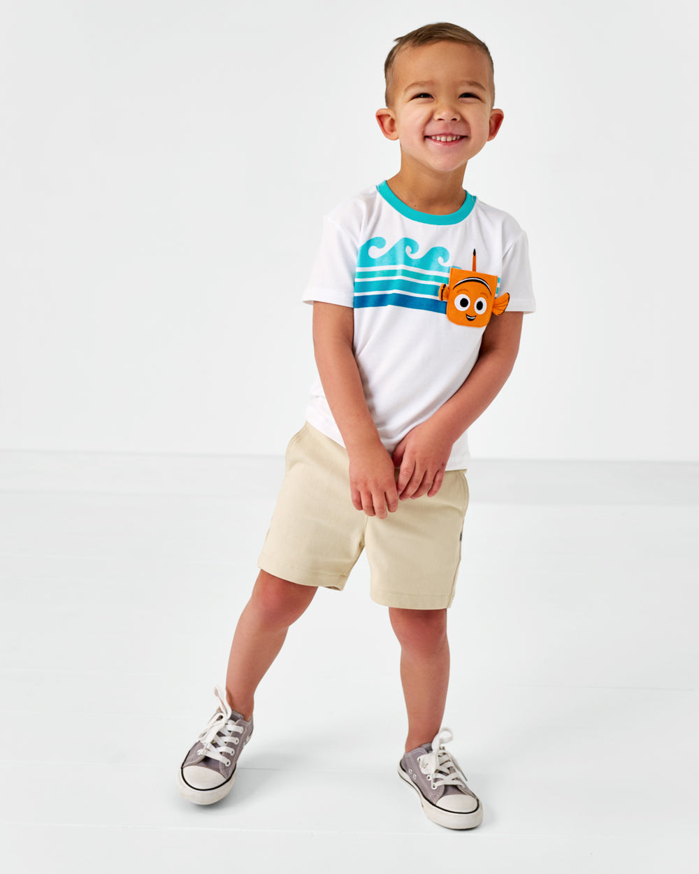 Standing child wearing the Disney Nemo Relaxed Bamboo Pocket Tee