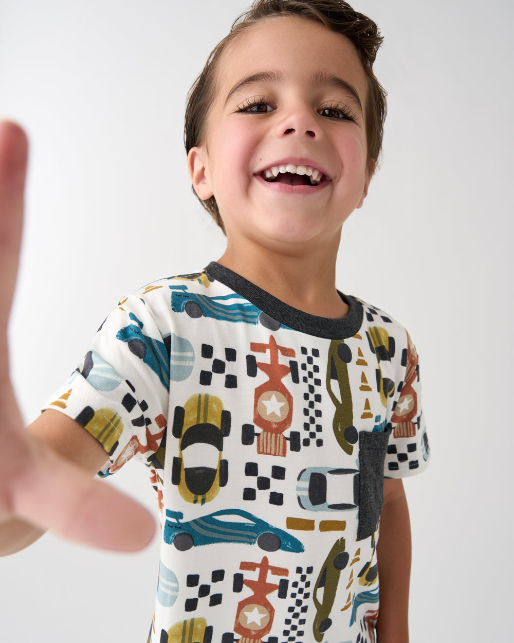 Close up of boy wearing the Fast Lane Relaxed Pocket Tee