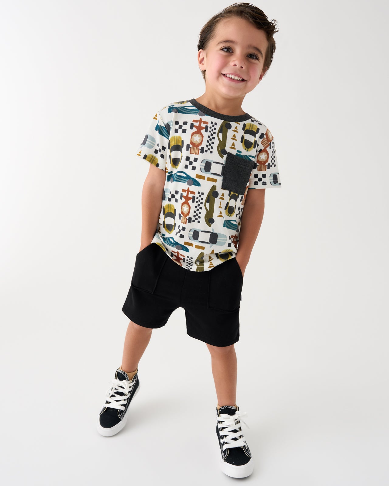 Boy wearing the Fast Lane Relaxed Pocket Tee with black shorts