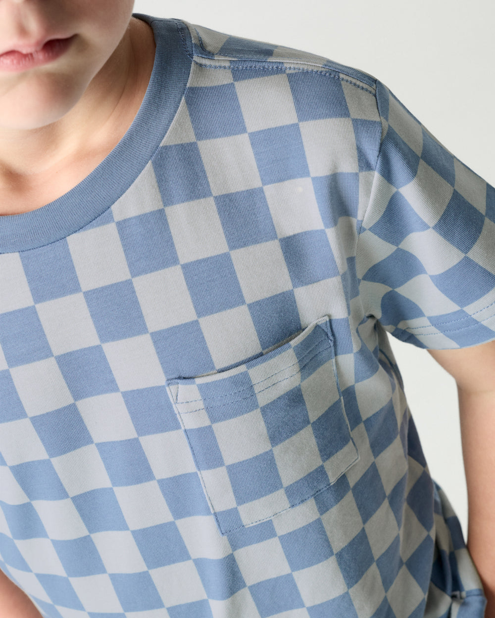 Close up of the pocket detail on the Dusk Blue Checks Relaxed Pocket Tee