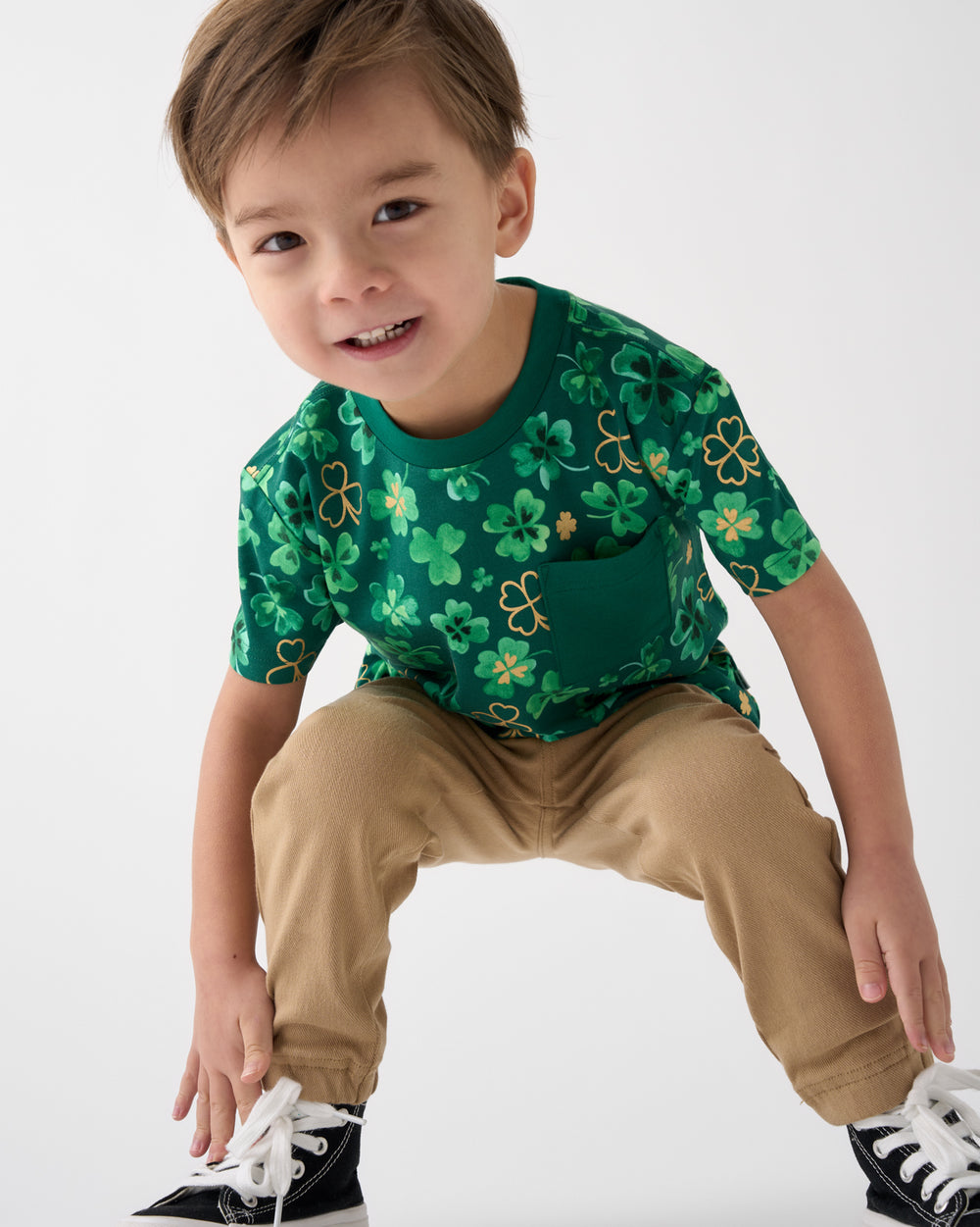 Boy wearing the Clover Cuties Relaxed Pocket Tee with khaki joggers