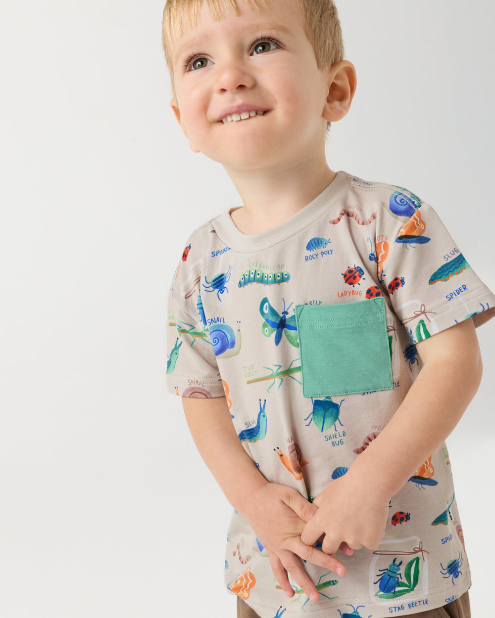 Close up of boy wearing the Nature Notes Relaxed Pocket Tee