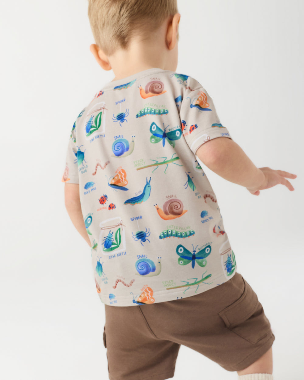 Back view of boy wearing the Nature Notes Insect Print Tee